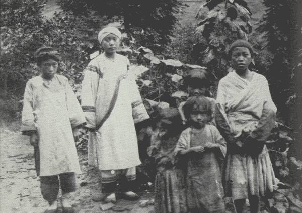 RATHER A RARE PICTURE OF TRIBES  Three tribes are shown: White Bones (left), attending her mistress, a Nou-su aristocrat (Black Bones); the children at the right are Hua Miao.