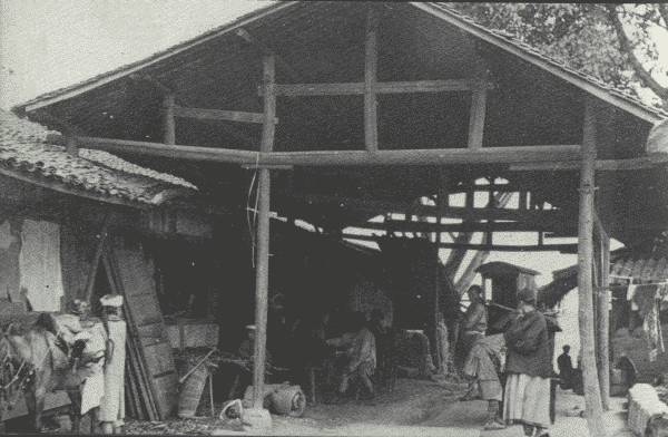 THE WELCOME FAMILIAR TEA-HOUSE  In many provinces of China, tea-houses, of which this one in Eastern Szech'uan is typical, are to be found about every ten li (3 miles) on the main road.