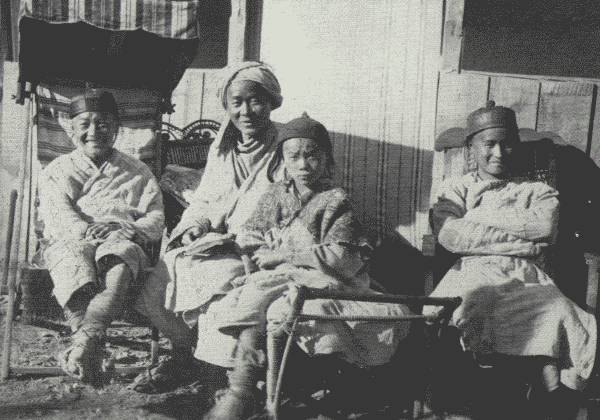 REFORMED HUA MIAO STUDENTS TAKING IT EASY  Picture shows how much they have benefitted under the missionary's influence. Taken at the British mission compound in Tongch'uanfu.