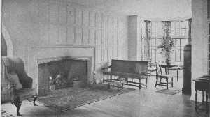 This is in reality a moderate-sized room, yet the open arrangement and the clear center give the impression of great space. The curve of the fireplace and the oak panelling are simple Tudor. The furniture is a mixture of many kinds.