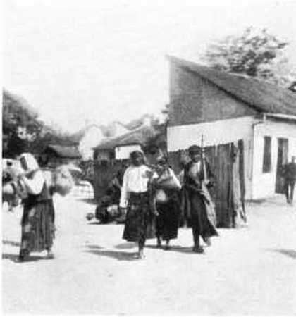 PEASANT WOMEN LEAVING THEIR VILLAGE.