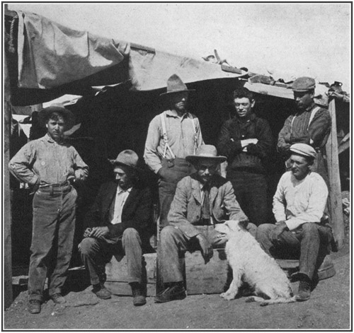 Fig. 43.: American Museum party at Bone-Cabin Quarry, 1899. Seated, left to right Walter Granger, Professor H.F. Osborn, Dr. W.D. Matthew; standing, F. Schneider, Prof. R.S. Lull, Albert Thomson, Peter Kaison.