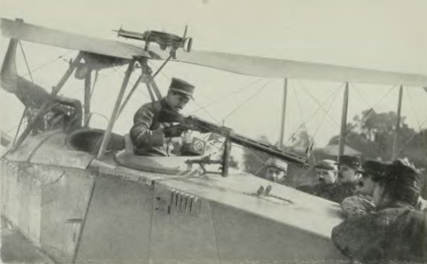 German Aeroplane Trophy--Jules Vedrine Examining the Machine Gun