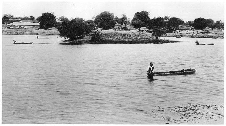 Fishermen in dug-outs or hollowed tree trunks.