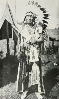 An older man in traditional dress.