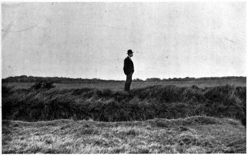 Man standing on top of a Galway bank