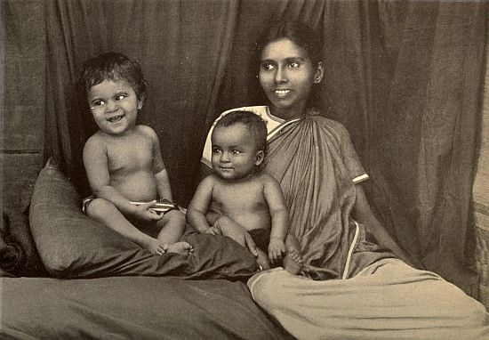 PONNAMAL, WITH PREETHA ON HER KNEE, AND TARA BESIDE HER.