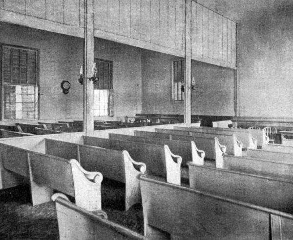 INTERIOR OF FRIENDS' MEETING-HOUSE Whittier's usual seat marked, on left side, near "facing seats."