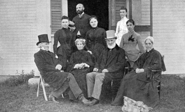 GROUP AT STURTEVANT'S, CENTRE HARBOR Gertrude Cartland at Whittier's left, Mrs. Wade and Joseph Cartland at his right. Mrs. Caldwell, wife of Whittier's nephew, at his left shoulder.