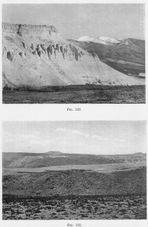 Fig. 132—Recessed volcanoes in the right background and eroded tuffs, ash beds, and lava flows on the left. Maritime Cordillera above Cotahuasi.