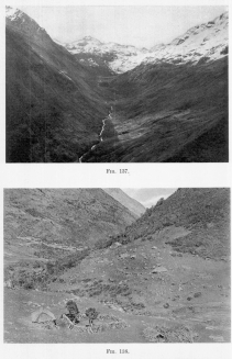 Fig. 137—Looking up a spurless flat-floored glacial trough near the Chucuito pass in the Cordillera Vilcapampa from 14,200 feet (4,330 m.). Note the looped terminal and lateral moraines on the steep valley wall on the left. A stone fence from wall to wall serves to inclose the flock of the mountain shepherd.