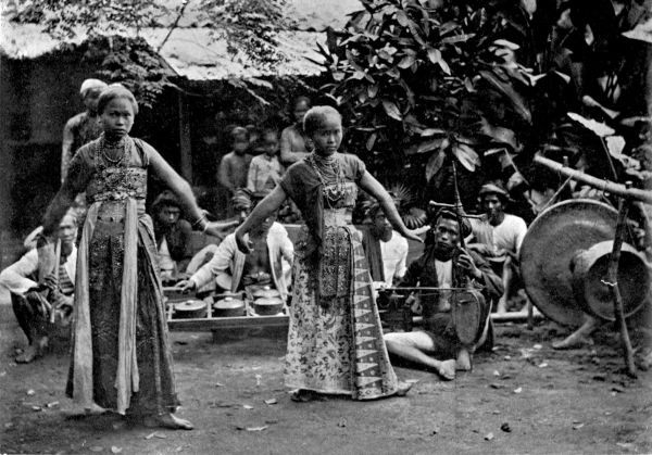 The dancers stand listening for the music.