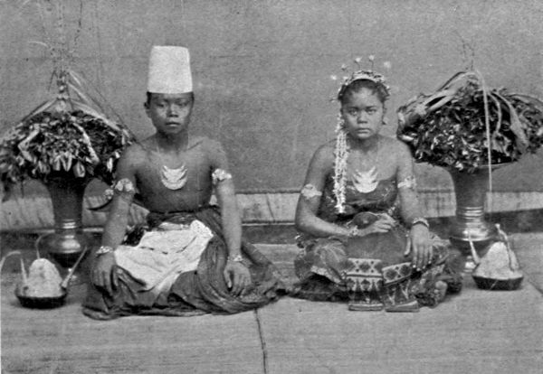 Bride and bridegroom sitting in state.