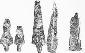 No. 252.   No. 253.   No. 254.   No. 255.   No. 256.  Trojan Lance-Heads of Copper.—TR.  No. 256. Copper Lance and Battle-Axe welded together by the Conflagration. The Pin-hole of the Lance is visible.—TR.