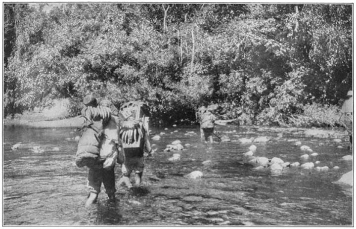 Peons Fording a River in the Andes.