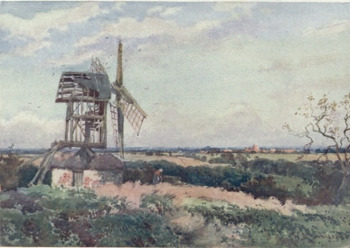 MADINGLEY WINDMILL  This old ruin is on a hill near Madingley, about four miles from Cambridge. A great sweep of Fen Country is seen in the far distance. The long range of red buildings in the middle distance is Girton College. On a clear day Ely Cathedral can be seen from the left of the windmill.