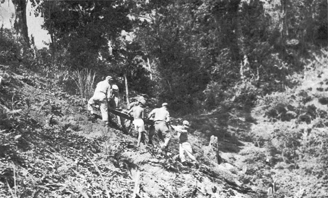 A LITTER SQUAD EVACUATES A CASUALTY in mountainous terrain.