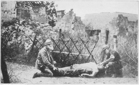 AMBULANCE MEN WORKING OVER A GASSED SOLDIER