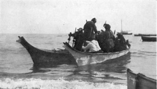 WATERMAN—CANOES  PL. III  TWO SUQUAMISH “WAR CANOES” LASHED TOGETHER AND CARRYING A PLATFORM OF POLES  This device was used in transporting house-planks and for moving large quantities of effects from one site to another. (Photographed at Suquamish, Washington, 1913.)