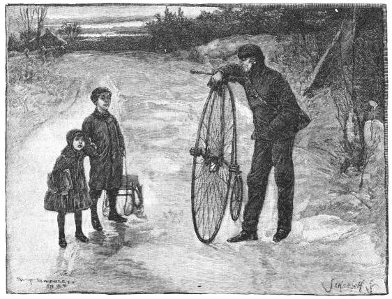 two children taking to man with bicycle