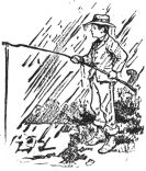 boy fishing in pouring rain