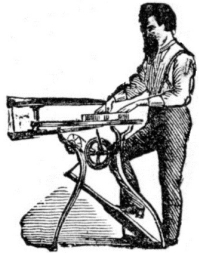 man operating scroll saw