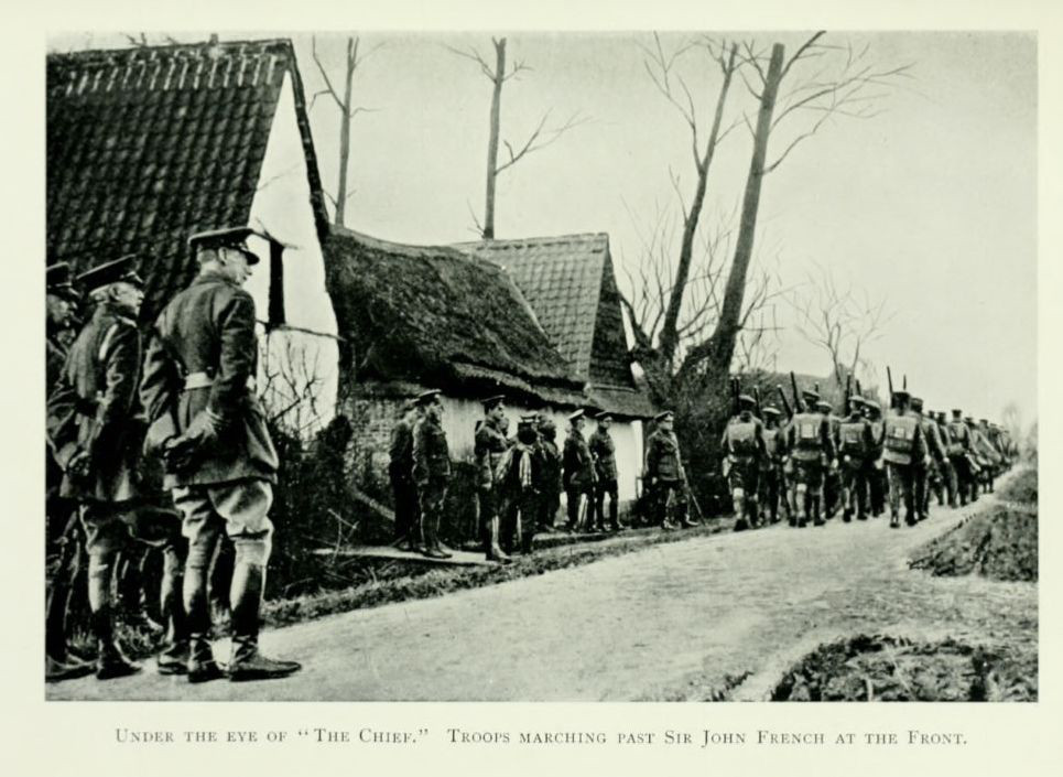 Under the eye of “The Chief.” Troops marching past Sir John French at the Front.