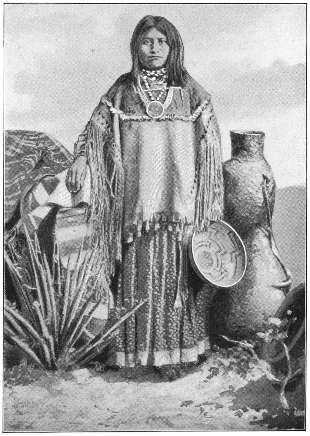 Apache Woman with her Handiwork. Yucca Plant in Foreground