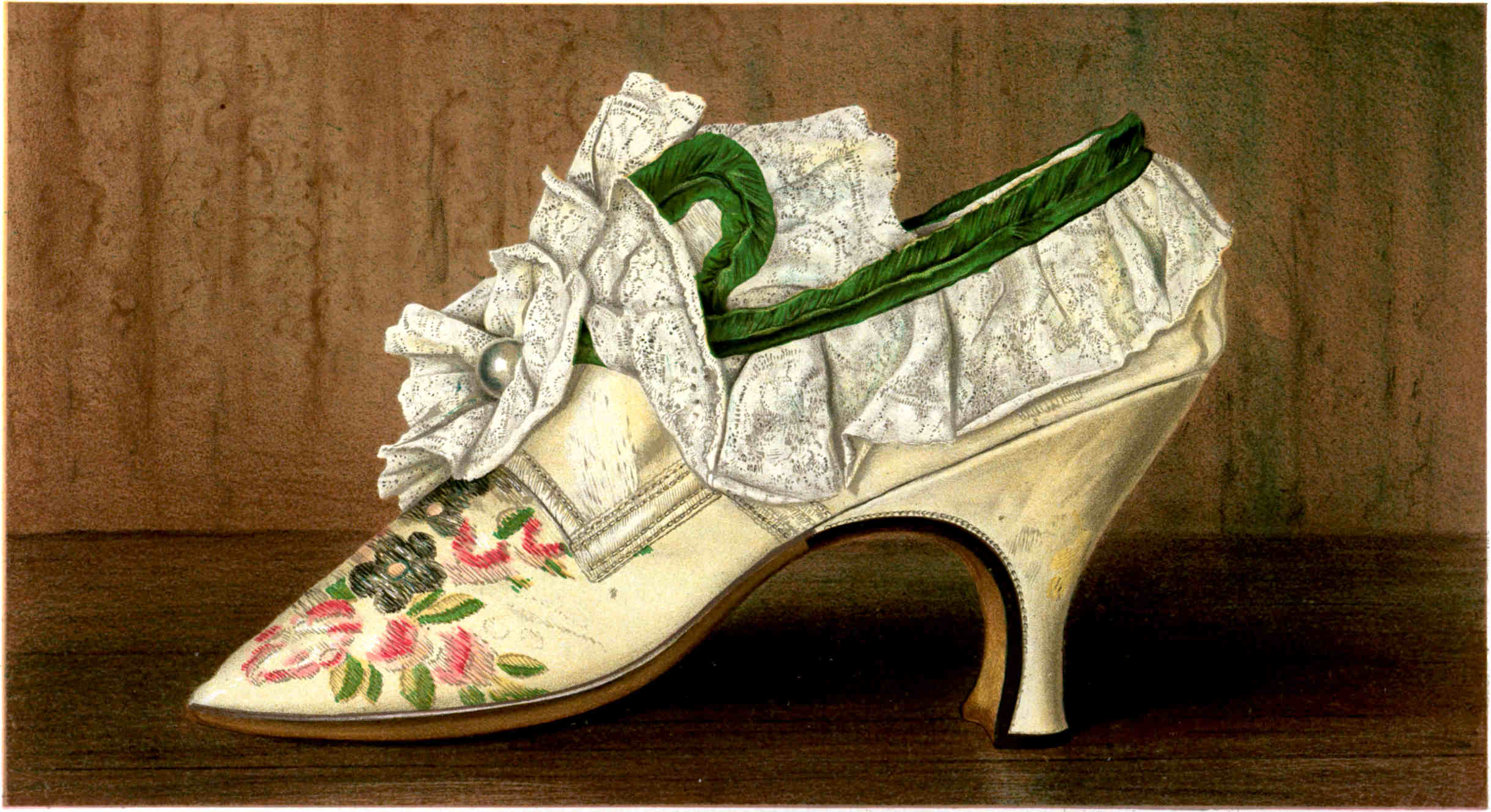 A cream-colored high-heeled shoe with flower patterns, lace ruffles, a green ribbon, and a silver button on the front.