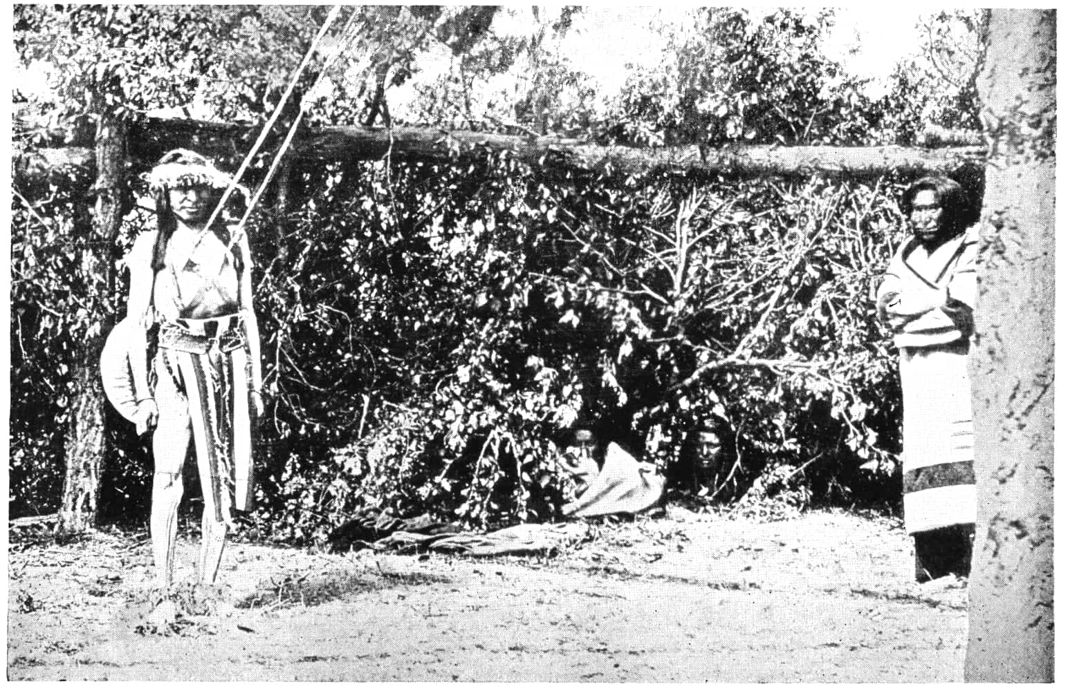 Two natives standing apart.