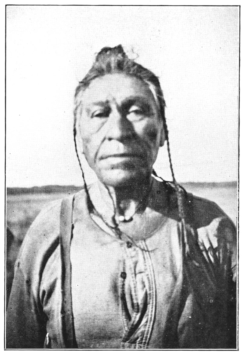 A native man pictured from the chest up.