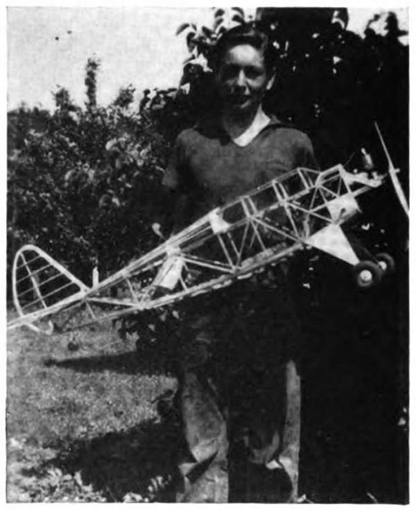 Picture of a boy with a large model plane