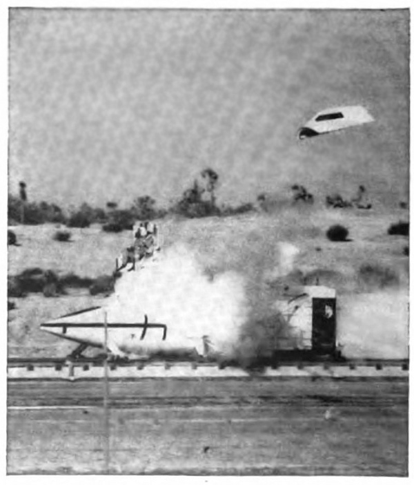 A plane on the ground with a canopy blowing away