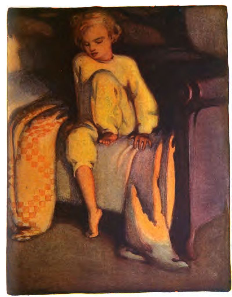 A young child with short blonde hair sits on the edge of the bed wearing yellow pajamas and keeping their head lowered with eyes closed or looking down. Barefoot, one leg hangs toward the floor while the other is pulled close. One hand rests on the bed. On the left, an orange and cream checkered blanket drapes over the bed.