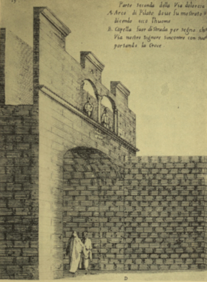 An arch with two men nearby for scale.
