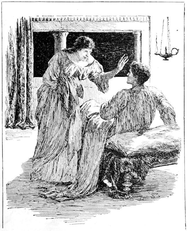 Woman with her hand raised standing over a man reclining on a couch.