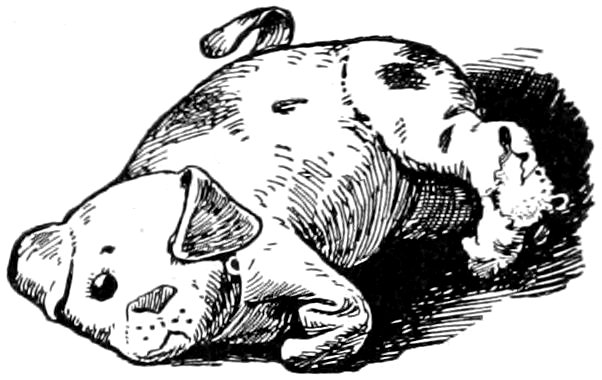 Toy dog lying on its back.