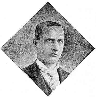 Head view in diamond frame; folded corner wings collar, patterned half Windsor tie.