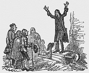 Man on soapbox speaking to a crowd