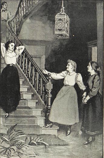 one girl coming down stairs to two girls waiting