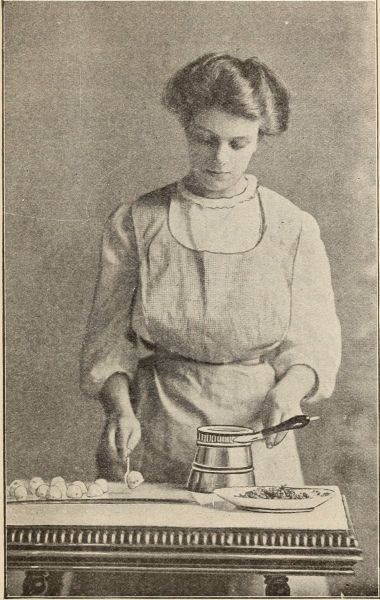 Photograph woman making bon-bons