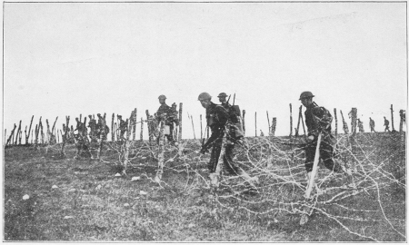 ALLIED TROOPS CHARGING THROUGH BARBED-WIRE ENTANGLEMENTS