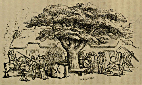 A group of revellers under a tree