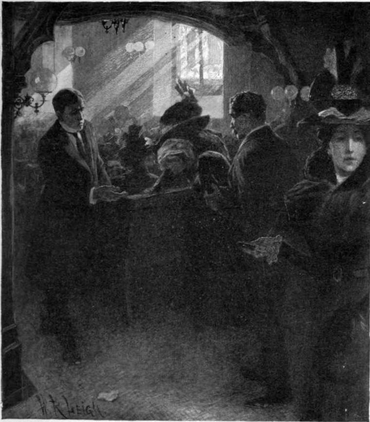 People gathered in a room lit by the sun streaming in from a window.
Some are seated in pews and some are standing.