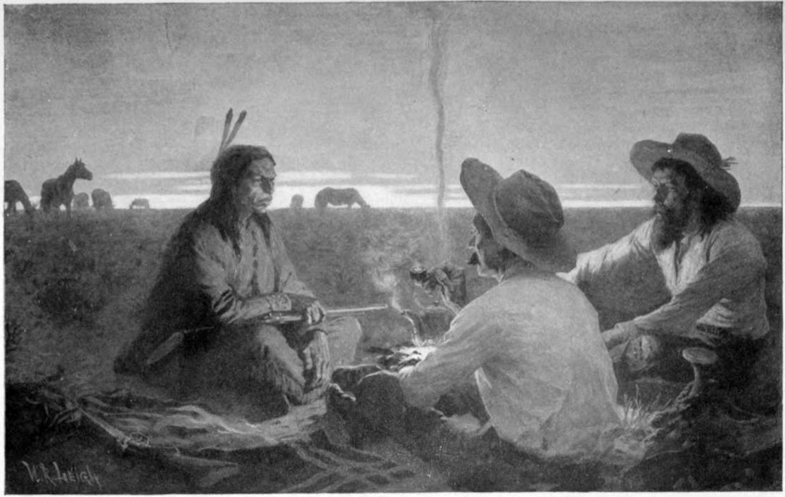 Three men sit on the ground around a campfire with one a Native
American. It is near sunset and there are horses in the background.