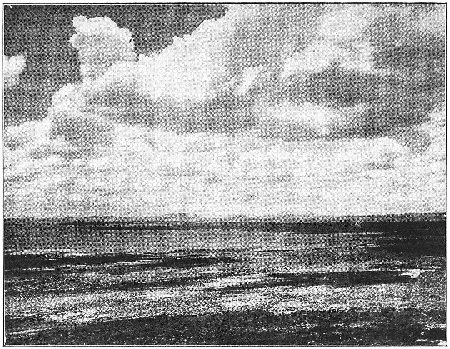 THE ENCHANTED DESERT AND THE MOQUI BUTTES, SEEN FROM THE PUEBLO OF WALPI