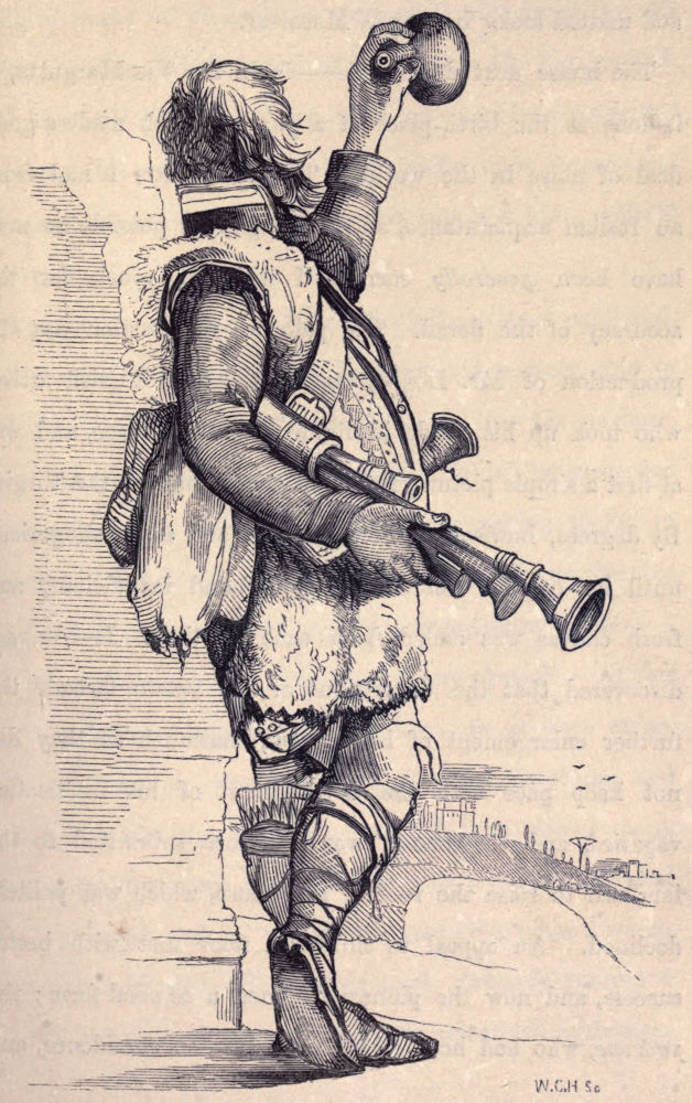 man standing holding a gun