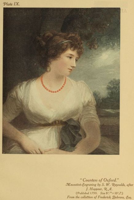 young lady with a red necklace