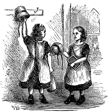 Two girls hanging up their hats