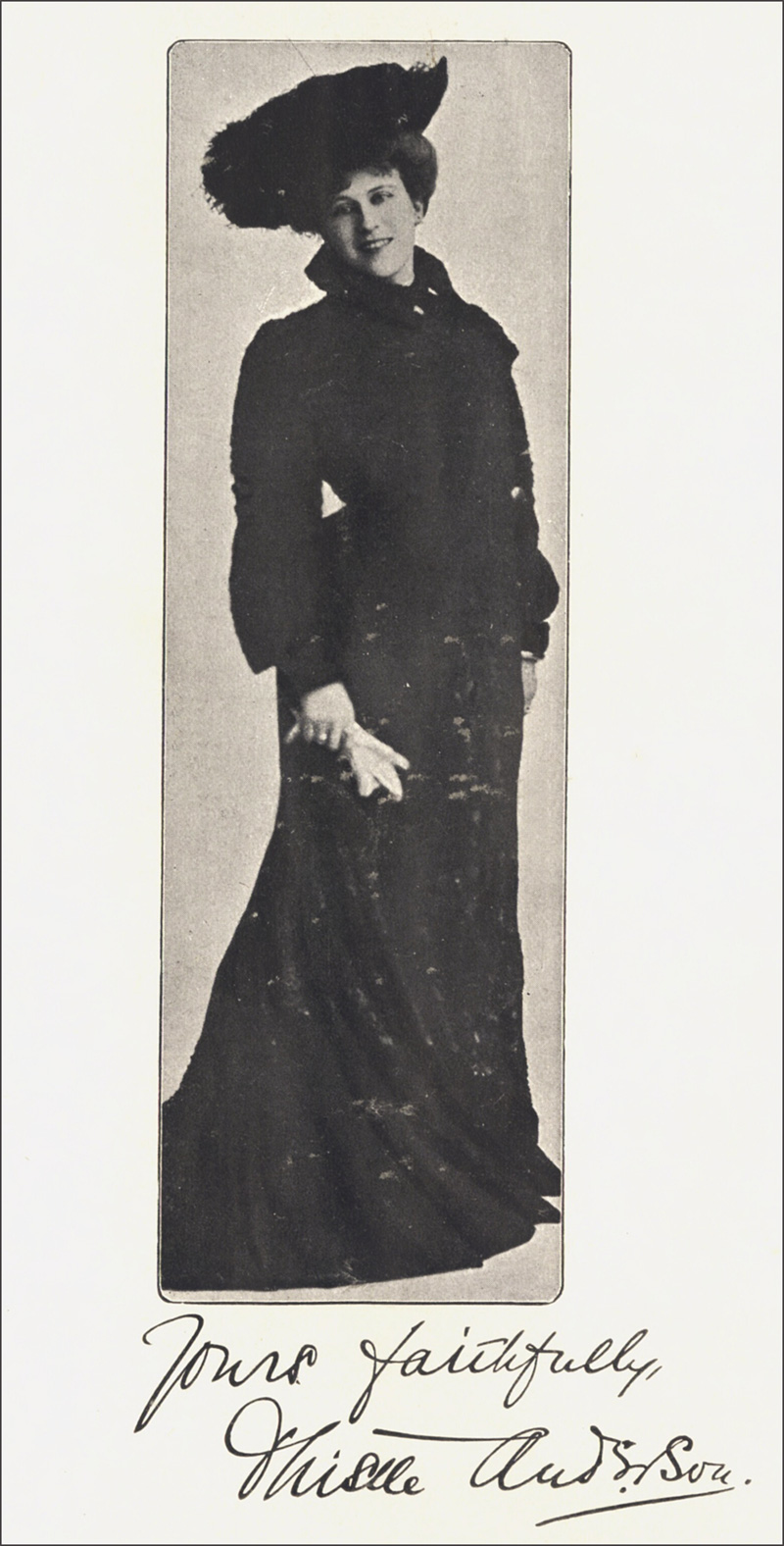 Autographed
    photo of the author posing, dressed in long sweeping dress, hat and gloves